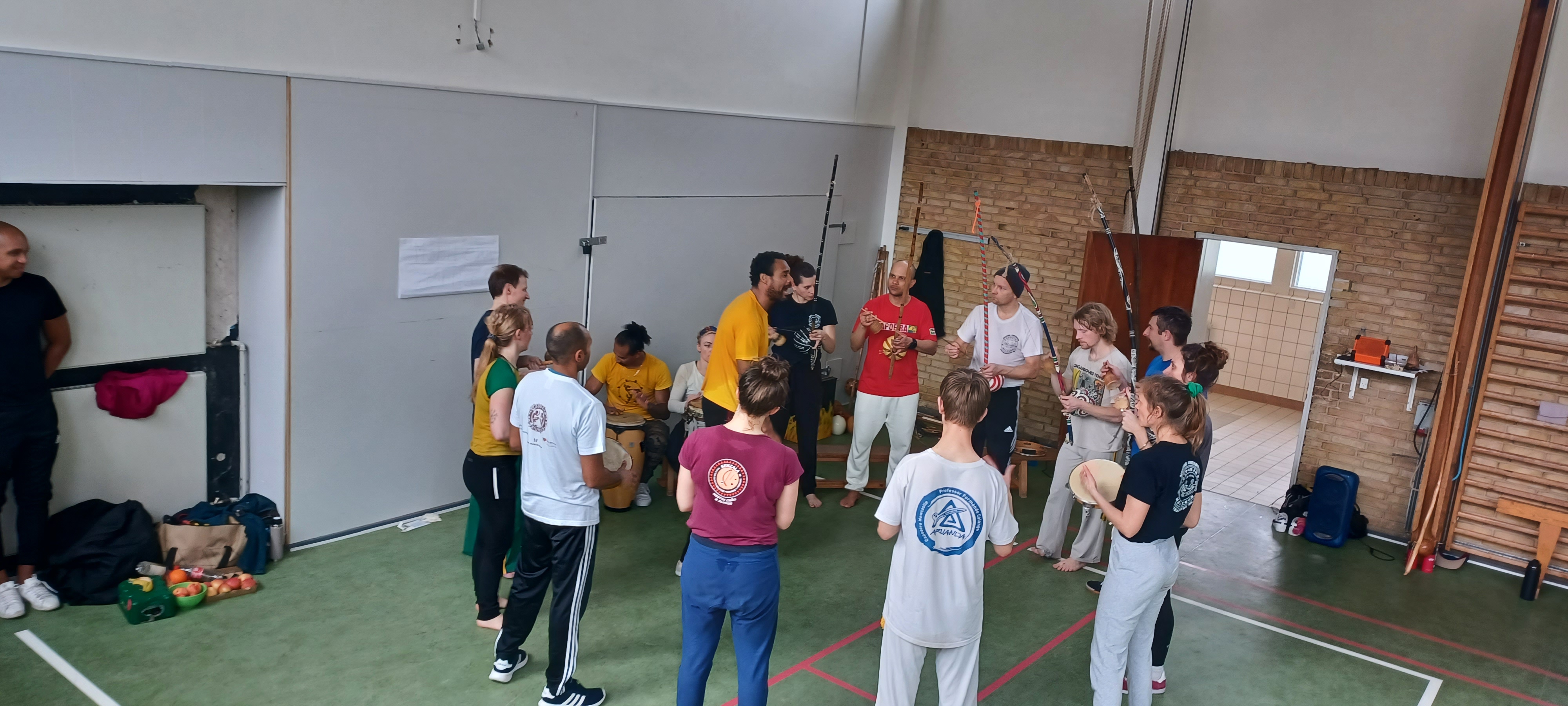 Capoeiristas gathered in a roda, celebrating together
